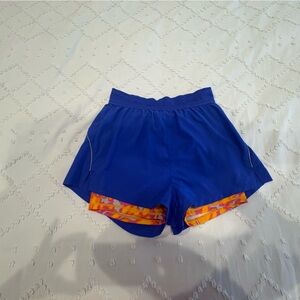 Fabletics Blue Athletic Shorts with Orange compression under short